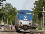 AMTK 39 leads train 80 away from the station